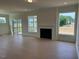 Spacious living room featuring a fireplace and views of the outdoors at 243 Kissington Way, Benson, NC 27504