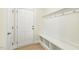 Mudroom with hooks, bench, and shelving at 243 Kissington Way, Benson, NC 27504