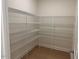 Walk-in pantry featuring wire shelving and ample storage space for food and kitchen essentials at 243 Kissington Way, Benson, NC 27504