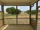 The screened porch offers peaceful views of the backyard and trees at 243 Kissington Way, Benson, NC 27504