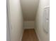 Storage room with wood-look flooring and white walls at 243 Kissington Way, Benson, NC 27504