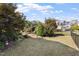 Large backyard with a pergola and a seating area offers a relaxing outdoor space at 2526 Snowdrop Ct, Apex, NC 27502