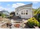 Inviting backyard with stone patio, fire pit, and lush landscaping; perfect for outdoor relaxation at 2526 Snowdrop Ct, Apex, NC 27502