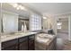 A bathroom featuring tiled floors and tub, granite countertops and dark wood cabinets at 2526 Snowdrop Ct, Apex, NC 27502