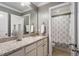 Full bathroom features a granite vanity and a shower with patterned curtain at 2526 Snowdrop Ct, Apex, NC 27502