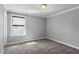 This bedroom features grey painted walls and carpet at 2526 Snowdrop Ct, Apex, NC 27502
