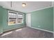 Bedroom with green painted walls, crown moulding and a window at 2526 Snowdrop Ct, Apex, NC 27502