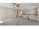 Spacious carpeted bonus room with ceiling fan and white trim at 2526 Snowdrop Ct, Apex, NC 27502