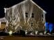 Professionally lit home exterior at night showcases the architectural details at 2526 Snowdrop Ct, Apex, NC 27502