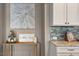 Granite countertop with backsplash; open shelving coffee bar in neutral gray kitchen at 2526 Snowdrop Ct, Apex, NC 27502