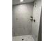 Modern bathroom with tile shower, rainfall shower head, and modern fixtures at 334 E Andrews Ave, Henderson, NC 27536