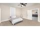 Comfortable bedroom with neutral paint, carpet, ceiling fan, and ample natural light at 334 E Andrews Ave, Henderson, NC 27536