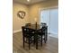 Dining area with modern table and sliding glass doors at 334 E Andrews Ave, Henderson, NC 27536