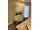 Charming kitchen with granite countertops, white cabinets, and a breakfast bar at 334 E Andrews Ave, Henderson, NC 27536