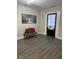 Cozy room with unique art and a bench with colorful pillows at 334 E Andrews Ave, Henderson, NC 27536
