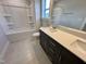 Bathroom showcasing a vanity with a single sink, tile floors, and a tub with shower at 367 Duncan Creek Rd # 129, Lillington, NC 27546