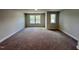 Bedroom with neutral walls, carpet, white trim, and two windows offering natural light at 367 Duncan Creek Rd # 129, Lillington, NC 27546