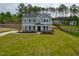 Two-story home boasts manicured lawn, long driveway and classic architectural details at 367 Duncan Creek Rd # 129, Lillington, NC 27546