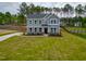Two-story home boasts manicured lawn, long driveway and classic architectural details at 367 Duncan Creek Rd # 129, Lillington, NC 27546
