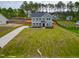 Two-story home boasts manicured lawn, long driveway and classic architectural details at 367 Duncan Creek Rd # 129, Lillington, NC 27546