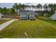 Two-story home boasts manicured lawn, long driveway and classic architectural details at 367 Duncan Creek Rd # 129, Lillington, NC 27546