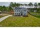 Two-story home boasts manicured lawn, long driveway and classic architectural details at 367 Duncan Creek Rd # 129, Lillington, NC 27546