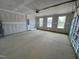 Spacious two car garage with automatic door, concrete floors, and three windows at 367 Duncan Creek Rd # 129, Lillington, NC 27546