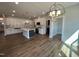 Modern kitchen with white cabinets, stylish island, stainless steel appliances, and wood flooring at 367 Duncan Creek Rd # 129, Lillington, NC 27546