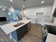Bright, modern kitchen featuring an island and stainless steel appliances at 367 Duncan Creek Rd # 129, Lillington, NC 27546