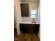 Laundry room featuring dark cabinets, a sink, and ample counter space at 367 Duncan Creek Rd # 129, Lillington, NC 27546