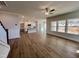 Open floorplan with living room and kitchen, wood floors, and white kitchen island at 367 Duncan Creek Rd # 129, Lillington, NC 27546