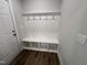 Mudroom with white storage bench and coat hooks near the door at 367 Duncan Creek Rd # 129, Lillington, NC 27546