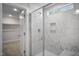 Modern bathroom features a luxurious marble tile shower with glass enclosure, creating a spa-like atmosphere at 367 Duncan Creek Rd # 129, Lillington, NC 27546