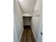 Interior shot of the home's walk-in storage closet with wire shelf and wood flooring at 367 Duncan Creek Rd # 129, Lillington, NC 27546