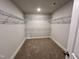 Walk-in closet with carpet, shelving, and an overhead light fixture at 367 Duncan Creek Rd # 129, Lillington, NC 27546