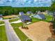 Aerial view of the home, landscaped yard, and surrounding neighborhood at 403 Duncan Creek Rd # 131, Lillington, NC 27546
