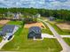 An aerial view of a lovely home surrounded by lush greenery, showcasing its location in a peaceful neighborhood at 403 Duncan Creek Rd # 131, Lillington, NC 27546