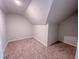 A carpeted bonus room features neutral paint and unique architectural features, creating a cozy, adaptable space at 403 Duncan Creek Rd # 131, Lillington, NC 27546