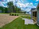 This house includes a patio in the backyard and fresh landscaping at 403 Duncan Creek Rd # 131, Lillington, NC 27546