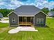 Aerial view of the back of the home with a porch and an expansive yard at 403 Duncan Creek Rd # 131, Lillington, NC 27546