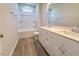 Modern bathroom with double vanity, white cabinets, and tub-shower combo at 403 Duncan Creek Rd # 131, Lillington, NC 27546