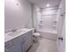 Bathroom featuring a single sink vanity, quartz countertop, tub and shower combination at 403 Duncan Creek Rd # 131, Lillington, NC 27546