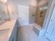 Bathroom featuring a double sink vanity, quartz countertop, large shower and tile flooring at 403 Duncan Creek Rd # 131, Lillington, NC 27546