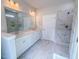 Bright bathroom featuring double vanity, marble floors and shower with glass door at 403 Duncan Creek Rd # 131, Lillington, NC 27546