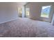 Bright bedroom with neutral walls, carpet flooring, large windows and an ensuite bathroom at 403 Duncan Creek Rd # 131, Lillington, NC 27546