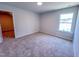 Bedroom with carpet flooring, neutral walls and large windows with trim at 403 Duncan Creek Rd # 131, Lillington, NC 27546