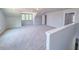 Spacious bonus room featuring neutral carpeting and large windows for natural light at 403 Duncan Creek Rd # 131, Lillington, NC 27546