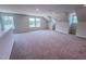 Upstairs bonus room with lots of natural light features carpet flooring and neutral walls at 403 Duncan Creek Rd # 131, Lillington, NC 27546