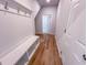 Entryway with bench, hooks, and hardwood flooring at 403 Duncan Creek Rd # 131, Lillington, NC 27546