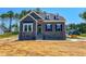 Charming two-story home with a stone and siding facade, inviting front porch, and well-manicured lawn at 403 Duncan Creek Rd # 131, Lillington, NC 27546